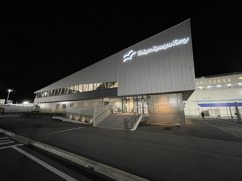 Exterior view of the illuminated Tokyo Kyushu ferry terminal at night