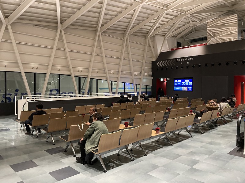 Rows of seating in the departure waiting area of the Tokyo Kyushu ferry terminal