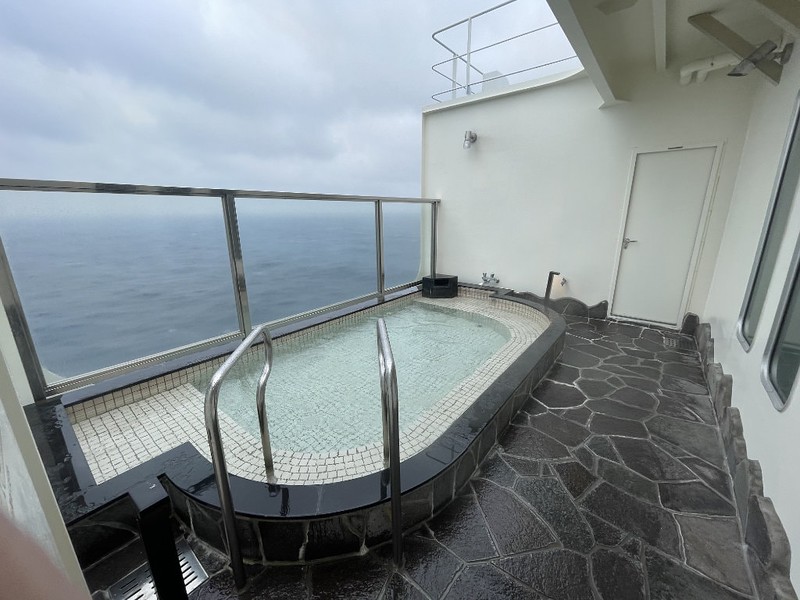 The outdoor open-air bath with a view of the ocean on the Ferry Soleil, Japan