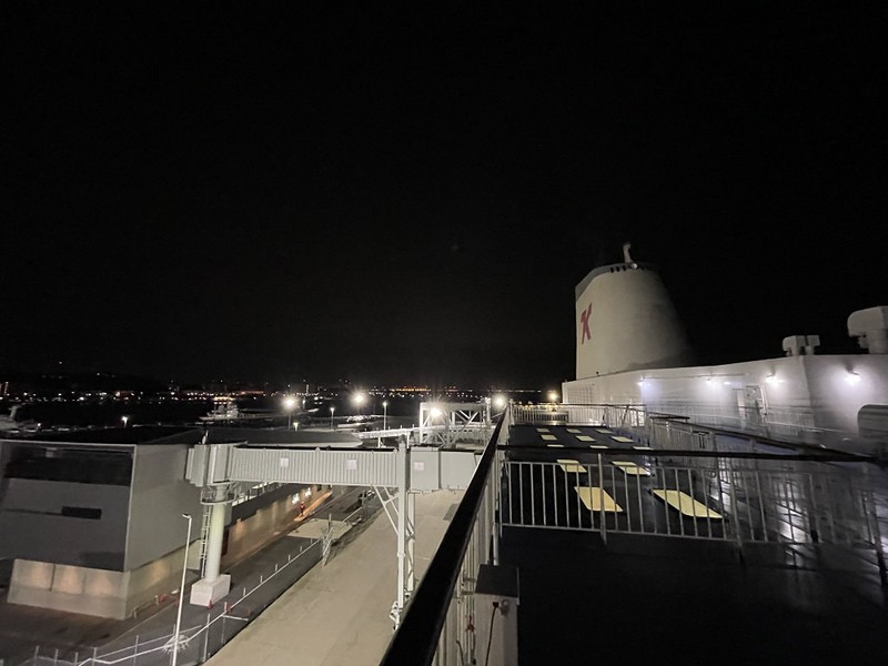 View of the ship and quayside at night from the Ferry Soleil, Japan, just before departure