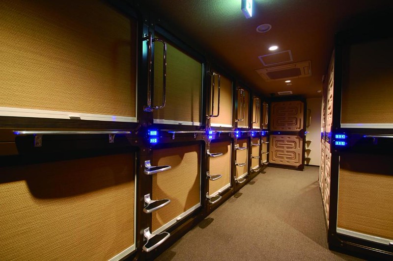 Double-decker capsules at Anshin Oyado Tokyo Shinbashi Ekimaeten with the blinds pulled down