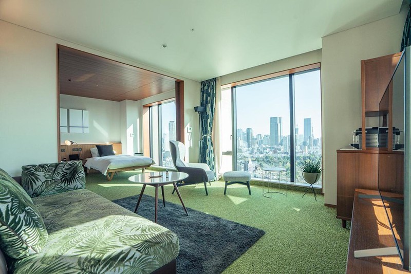Green and wooden interior of a corner twin suite in the Aoyama Grand hotel, Tokyo, Japan, with city views outside Green and wooden interior of a corner twin suite in the Aoyama Grand hotel, Tokyo, Japan, with city views outside