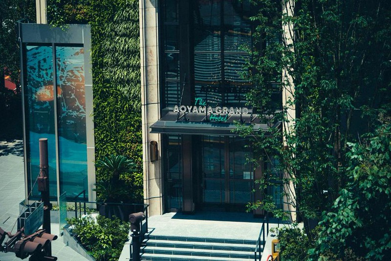 The plant covered exterior and entrance to The Aoyama Grand Hotel in Tokyo