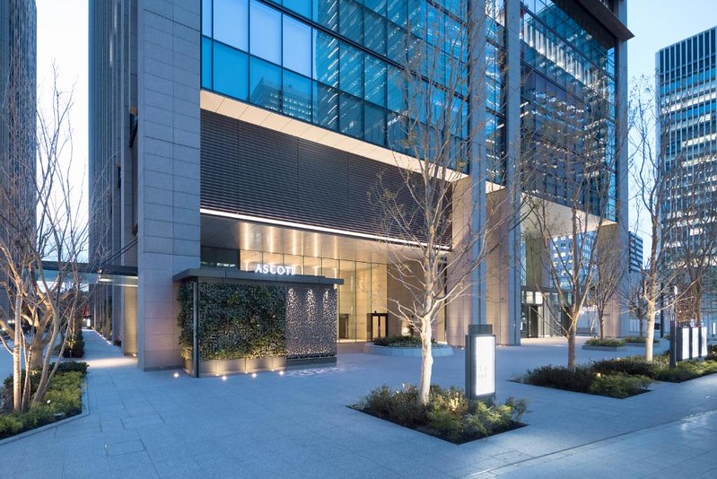 Illuminated exterior of the Ascott Marunouchi Hotel, Tokyo, at twilight