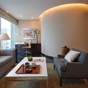 Living area with sofas and desk of the Four Seasons deluxe one-bedroom suite in Tokyo, Japan