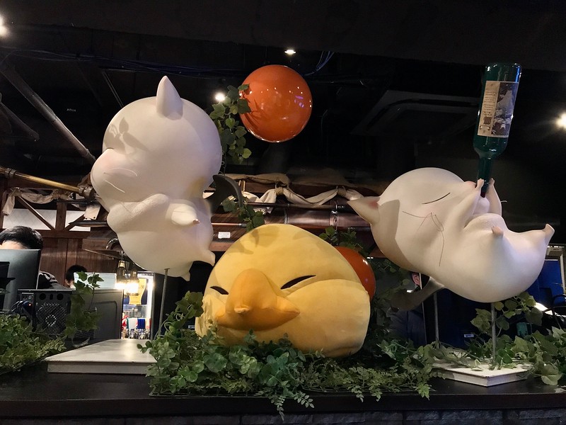 Floating moogle statues in the center of the cafe.