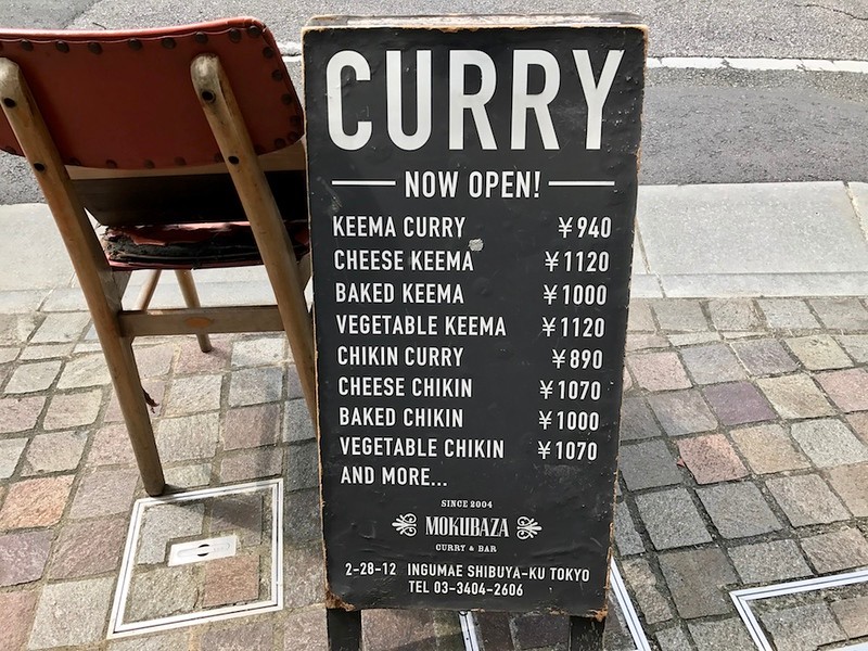 The back of the sandwich board has an English menu. Prices on this are not up-to-date.