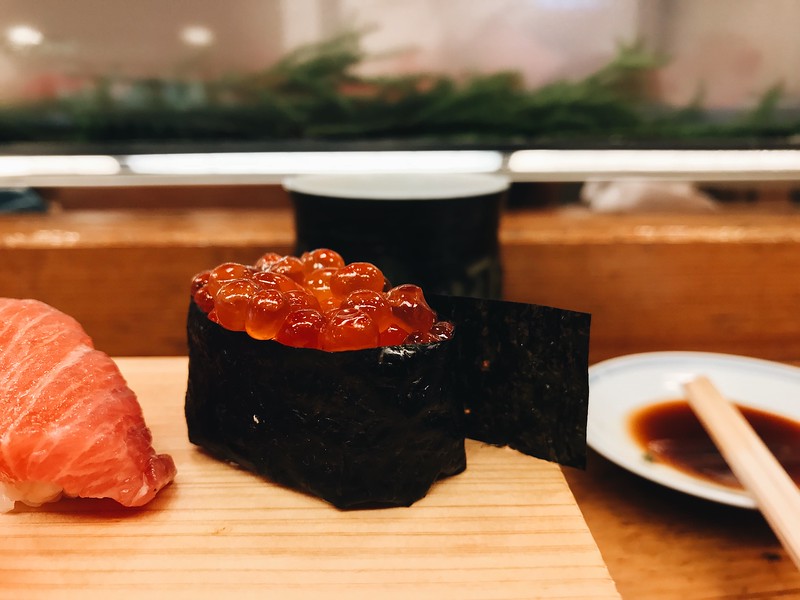 Close-up of ikura - shiny orange orbs of cod roe.