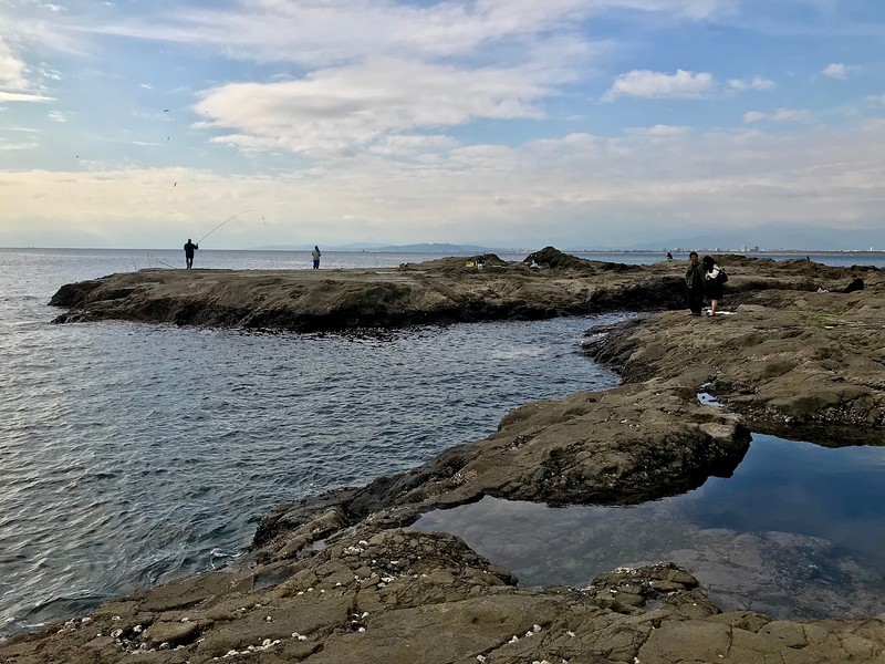 The view of Kanagawa from the plateau. A few people are fishing here.