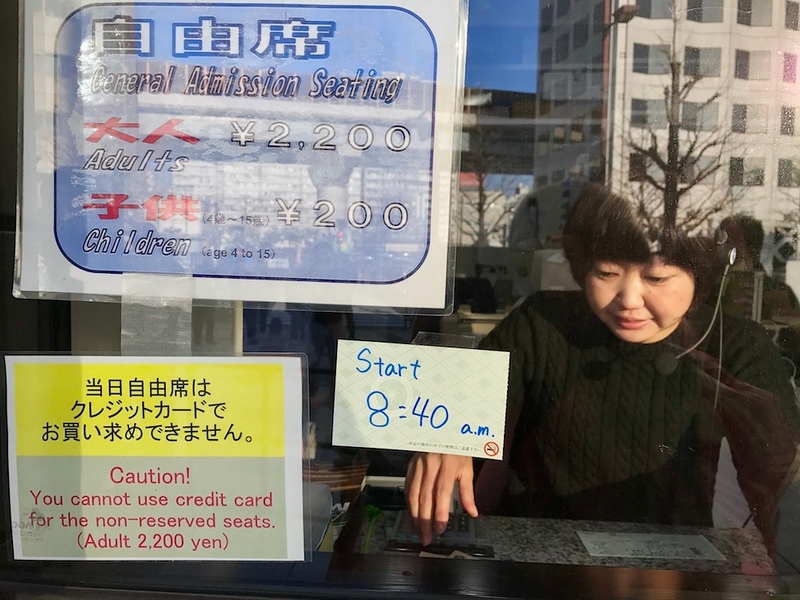 At the box office. A sign tells you that matches begin at 8.40am.