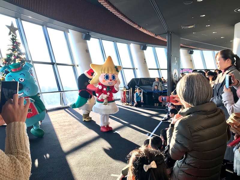 Mascots performing Christmas dances.