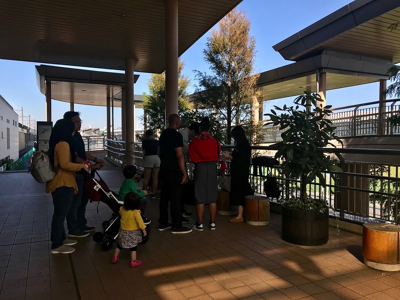 Staff handing out tickets to Disneyland.