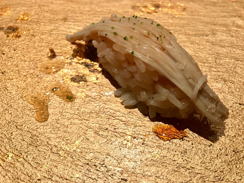 Kelp-marinated enoki mushrooms with green yuzu. Kelp-marinated enoki mushrooms with green yuzu.