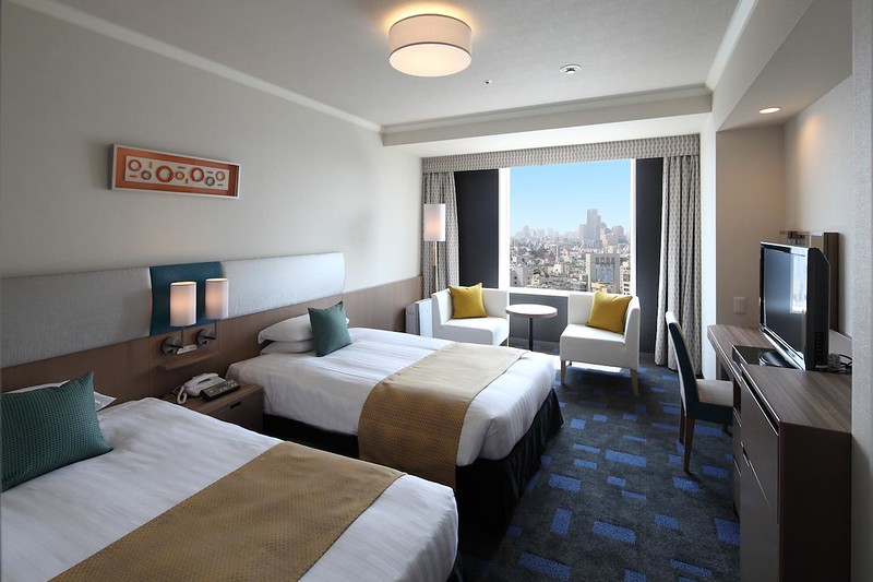 Twin room in the Shibuya Excel Hotel Tokyu with daytime cityscape outside the window Twin room in the Shibuya Excel Hotel Tokyu with daytime cityscape outside the window