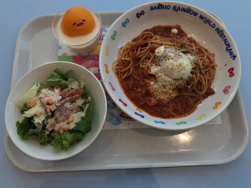A pudding, Caesar salad, and spaghetti bolognese.