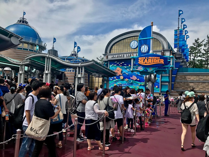 Long queues for the Nemo & Friends Searider attraction.