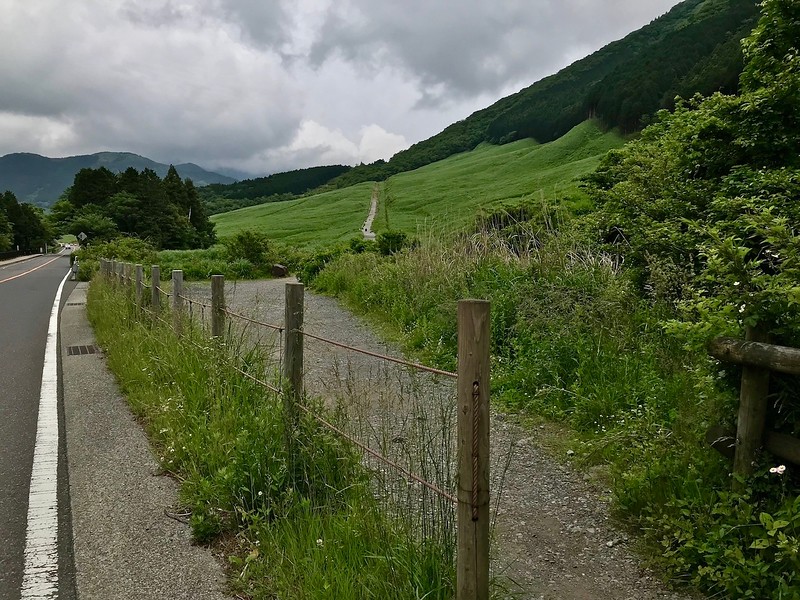 The path leading up the hill for the grass field.