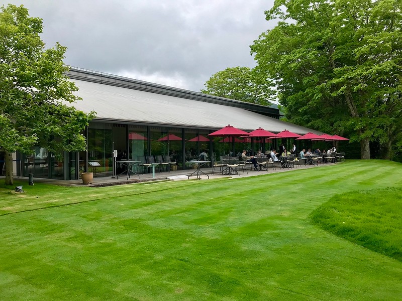 A green lawn in front of the museum cafe/restaurant.