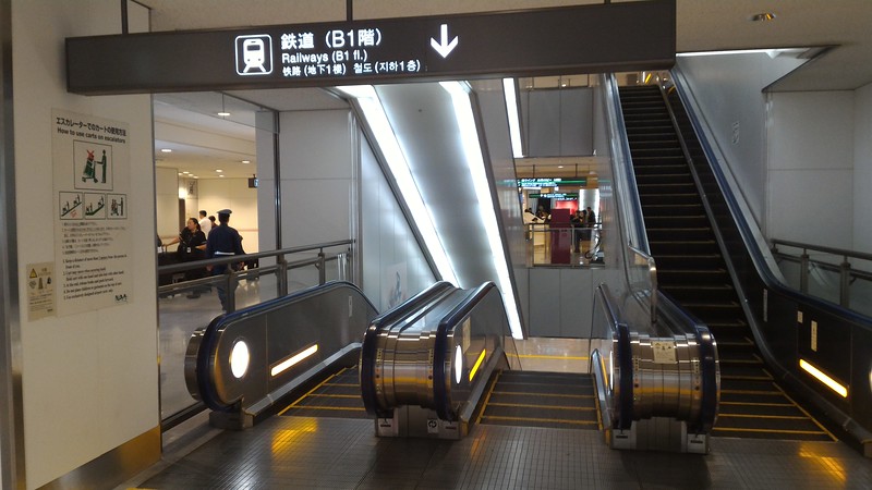 Escalators down to trains in arrivals hall