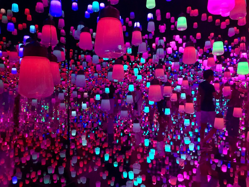 A thousand lamps suspended in a mirrored room.
