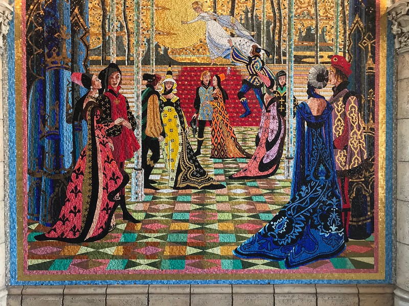 An intricate tiled mosaic wall in the castle corridor.