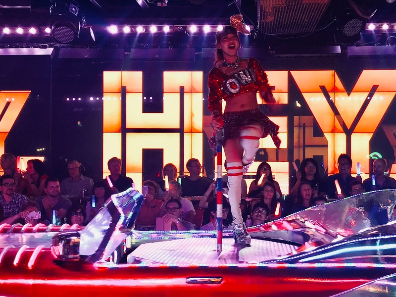 Dancing on top of a spinning platform on a car.