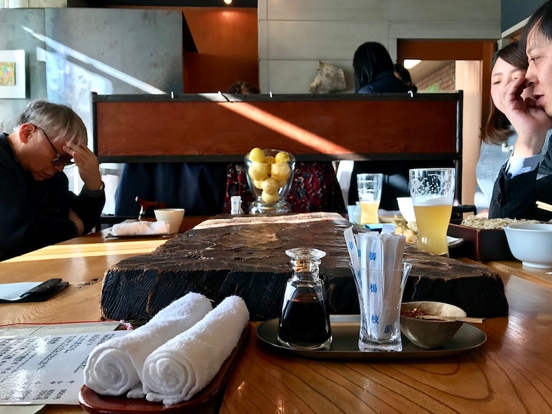 We’re seated at a communal table. The light is great.