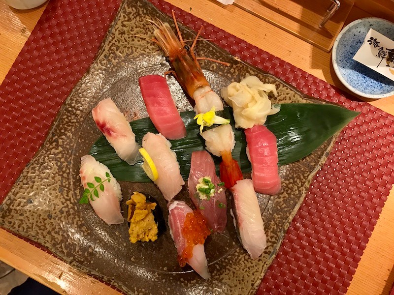 Fresh, generous slices of fish on vinegar rice, with a little heap of pickled ginger on the side. Fresh, generous slices of fish on vinegar rice, with a little heap of pickled ginger on the side.