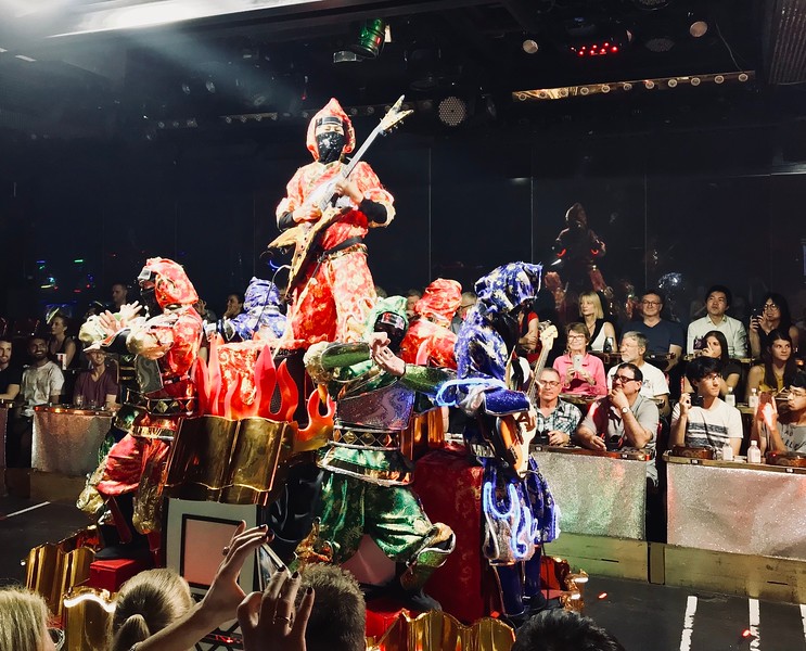 Colourful ninja electric guitar player.