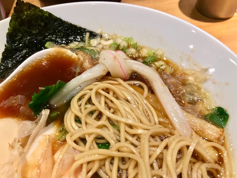 Close-up of noodles and a twist of fried fishcake. Close-up of noodles and a twist of fried fishcake.