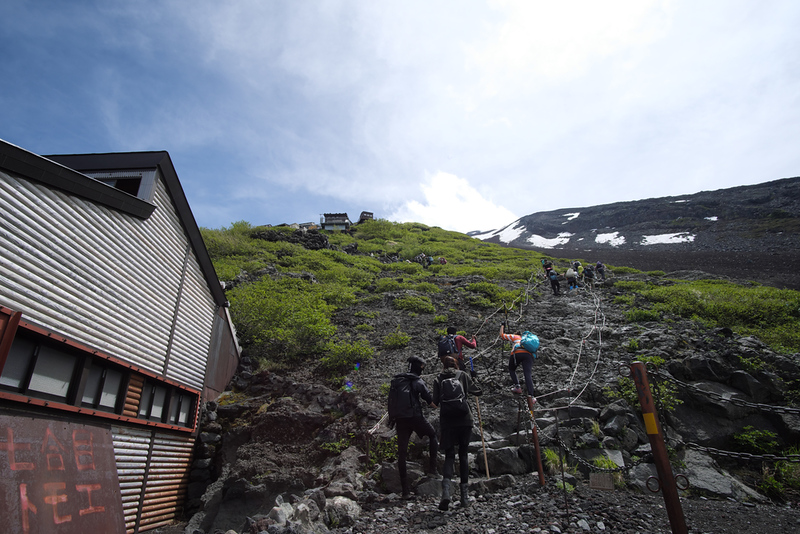 Climbers near mountain huts on Mt Fuji. Editorial credit: IsnakeDesign / Shutterstock.com