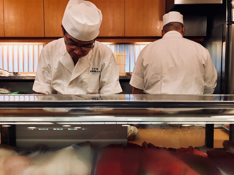 There are 4 - 5 chefs behind the counter - steady, constant action.