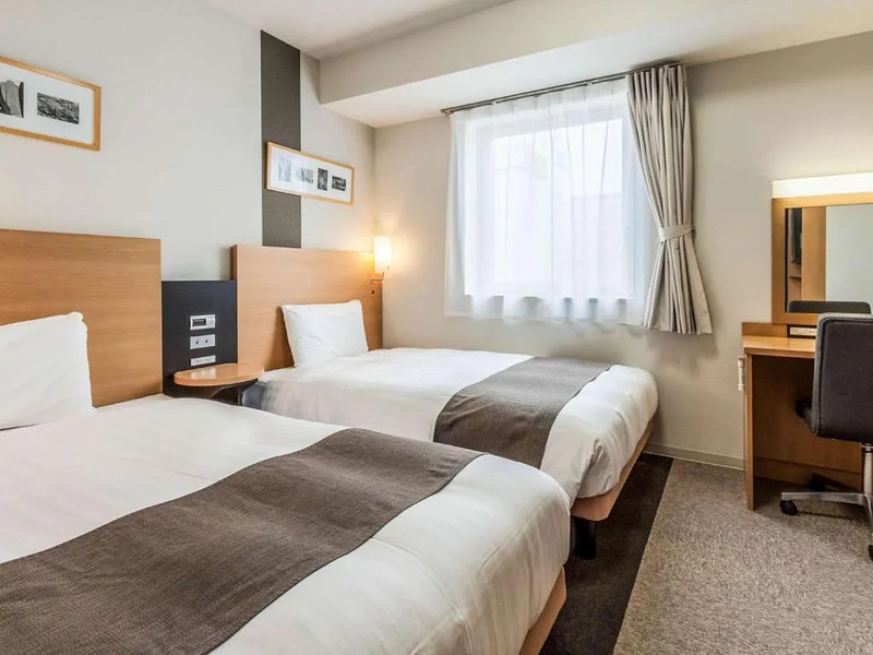 Two large twin beds in a Comfort Hotel guest room, Tokyo, Japan