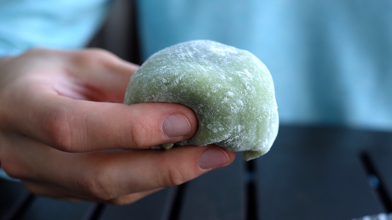 A soft, heavy matcha daifuku.