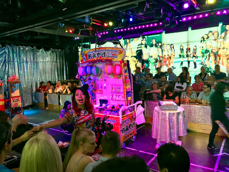 A staff member handing out noise-blocking headphones before the show starts.