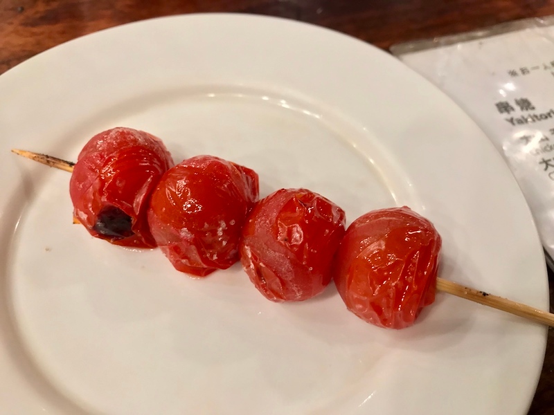 Grilled cherry tomatoes on a stick.