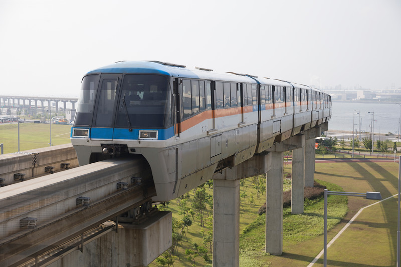 A side-on view of the Tokyo Monorail travelling from between Haneda Airport and Tokyo A side-on view of the Tokyo Monorail travelling from between Haneda Airport and Tokyo
