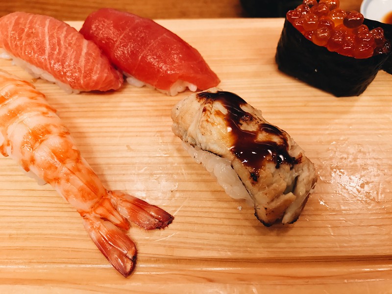 Left to right: Prawn, fatty tuna, lean tuna, anago (seawater eel), ikura. 