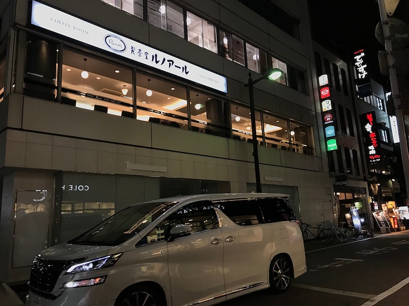 Turn right on this street with a cafe on the second floor of the corner building.
