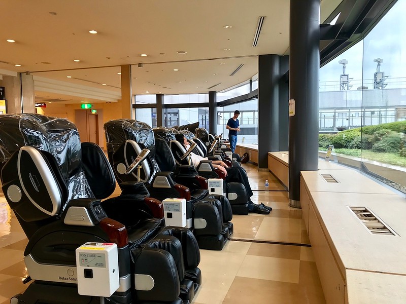 Massage chairs facing the window.