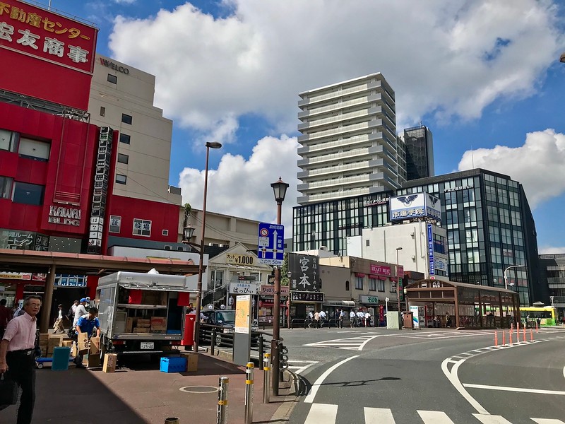 Walk in the direction of the building in front, following the road and turning right.
