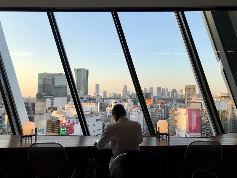 Viwe from the window-length desk gazing out over a late afternoon view of Tokyo from the tower of Shibuya Scramble Square