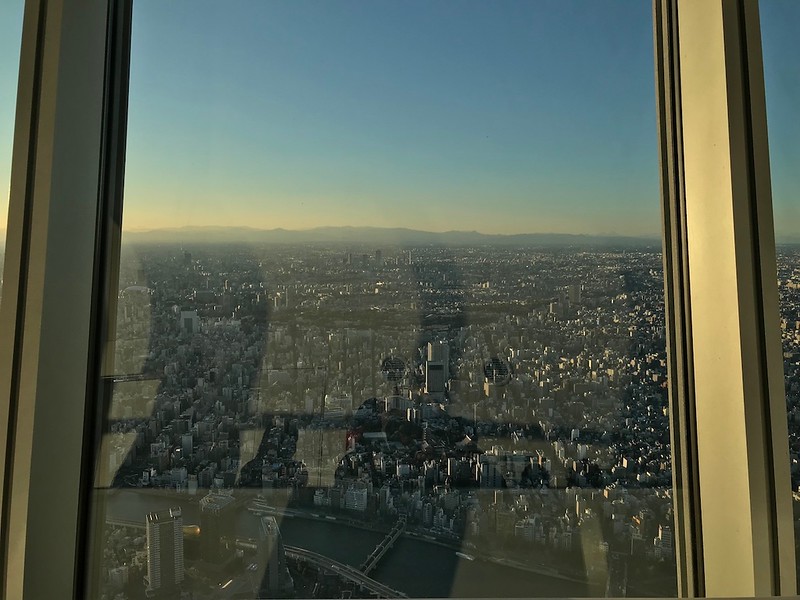 A fading sky, and mountains in the distance.