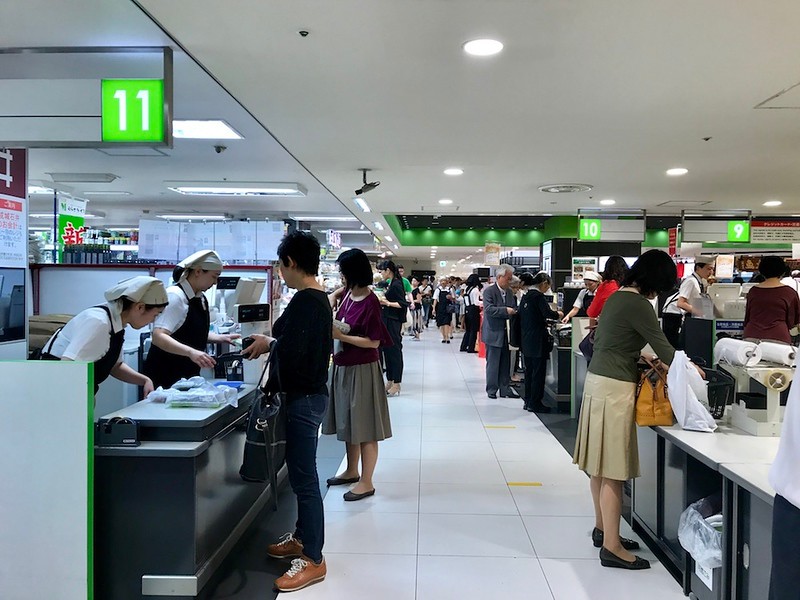 The view from the front of Uoriki - cashiers to the left, bagging tables to the right. The view from the front of Uoriki - cashiers to the left, bagging tables to the right.