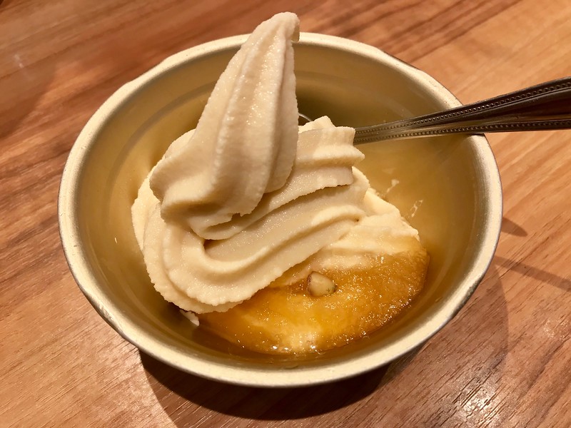 Soft serve topped with apple jelly and pumpkin seeds, served in the kind of light, sturdy metal bowl you see in Korean restaurants. Soft serve topped with apple jelly and pumpkin seeds, served in the kind of light, sturdy metal bowl you see in Korean restaurants.