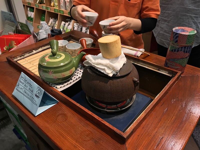 Sampling tea at the market.