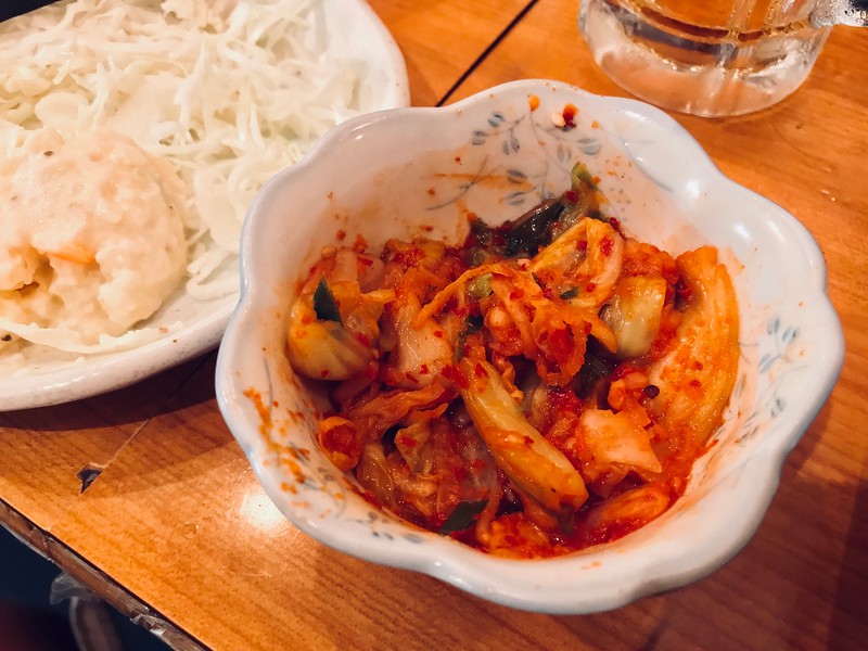 A small bowl of kimchi.