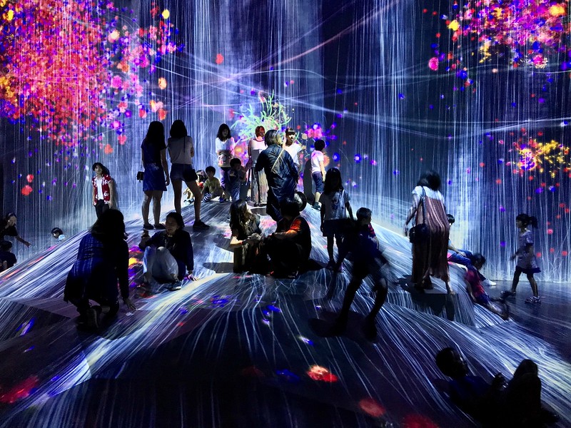 Many museum goers on the artwork Universe of Water Particles on a Rock where People Gather.