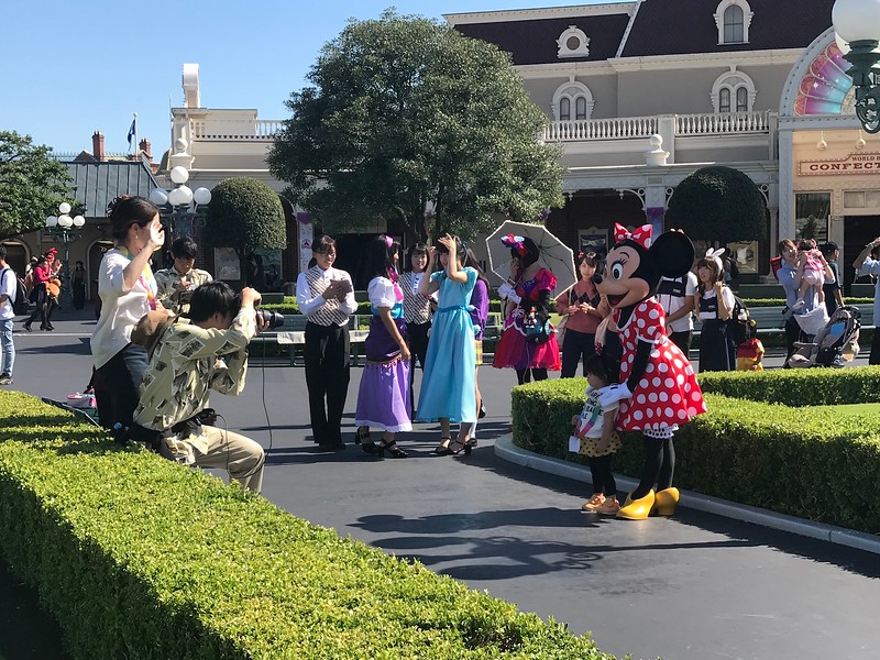 Being photographed with Minnie Mouse.