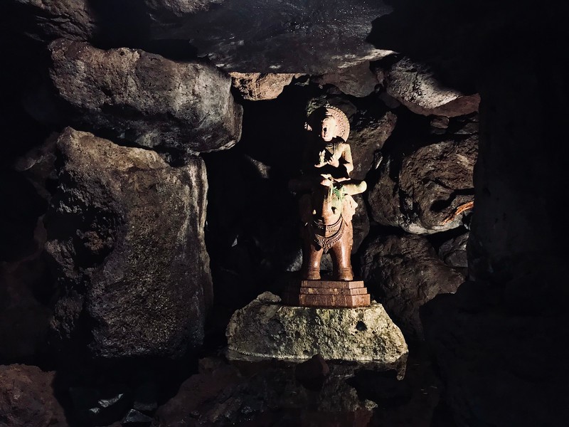 A statue inside a cave.